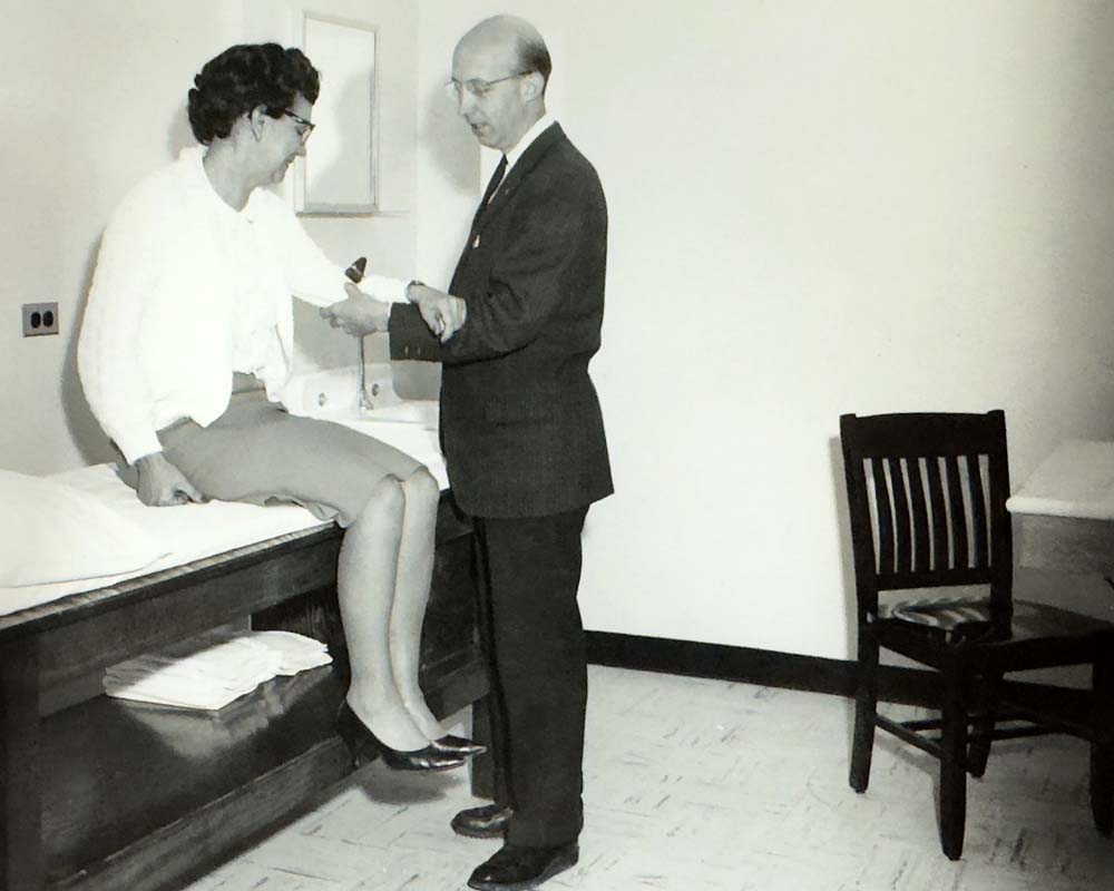 Guthrie orthopedic surgeon Albert M. Murtland, MD, with a patient in 1960. Dr. Murtland was at Guthrie for nearly 50 years, first beginning his tenure as an intern under Dr. Guthrie himself.
