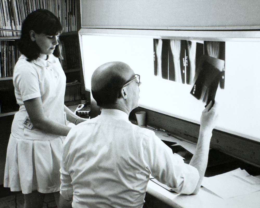 Dr. Murtland reviewing imaging, 1975.