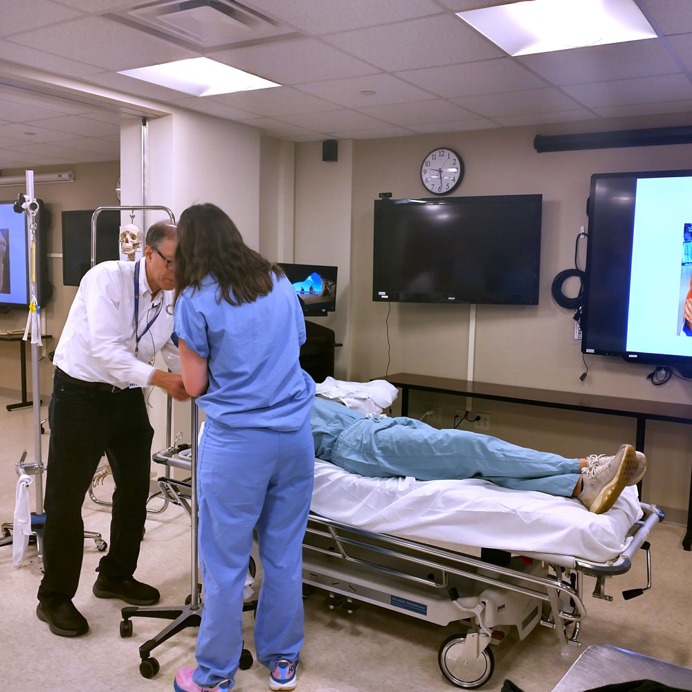 Medical team examines patient on a stretcher