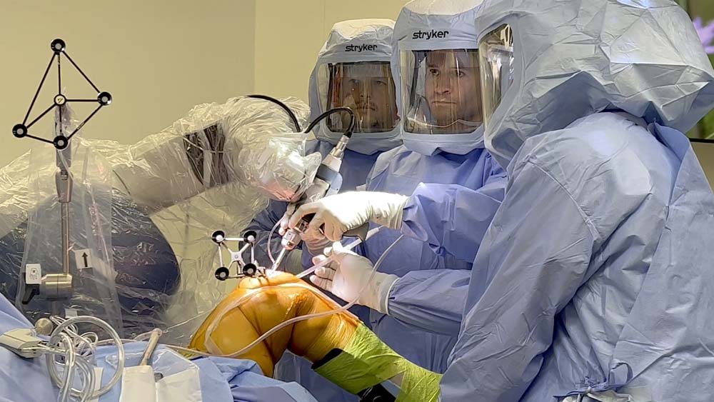 Residency Associate Program Director Jeffrey S. Lutton, MD, supervising residents in the OR.
